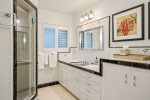 The large beautiful master bath has a dual vanity and step in shower.